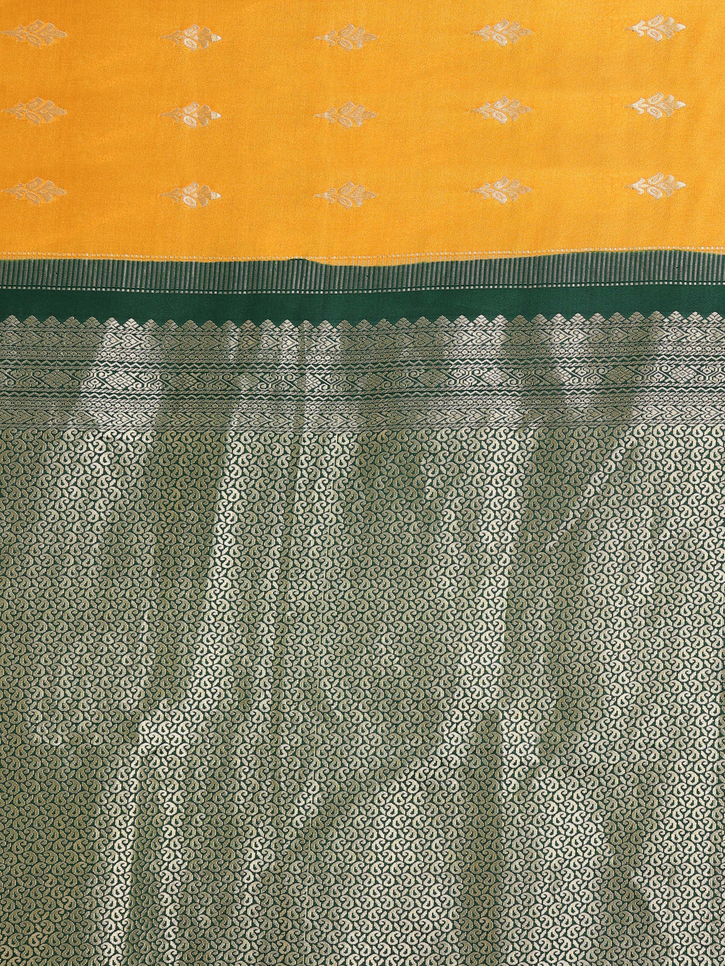 Close up of mango yellow body with two-tone silver gold zari floral bouquet buttas and deep forest green near-fully worked silver paisley jaal pallu