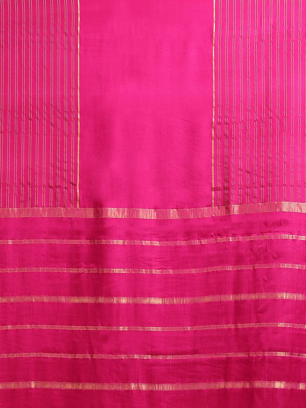 Close up of fuchsia body with fine vertical gold zari stripes and horizontal stripe pallu bands