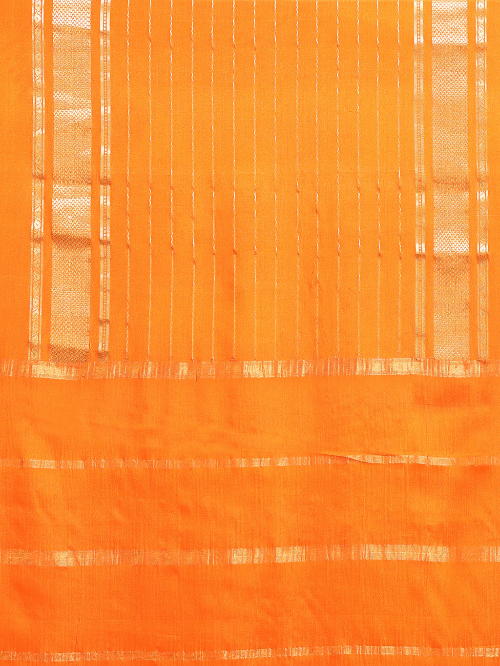 Close up of tangerine orange pallu with fine vertical gold zari stripe lines and horizontal gold zari dash rows