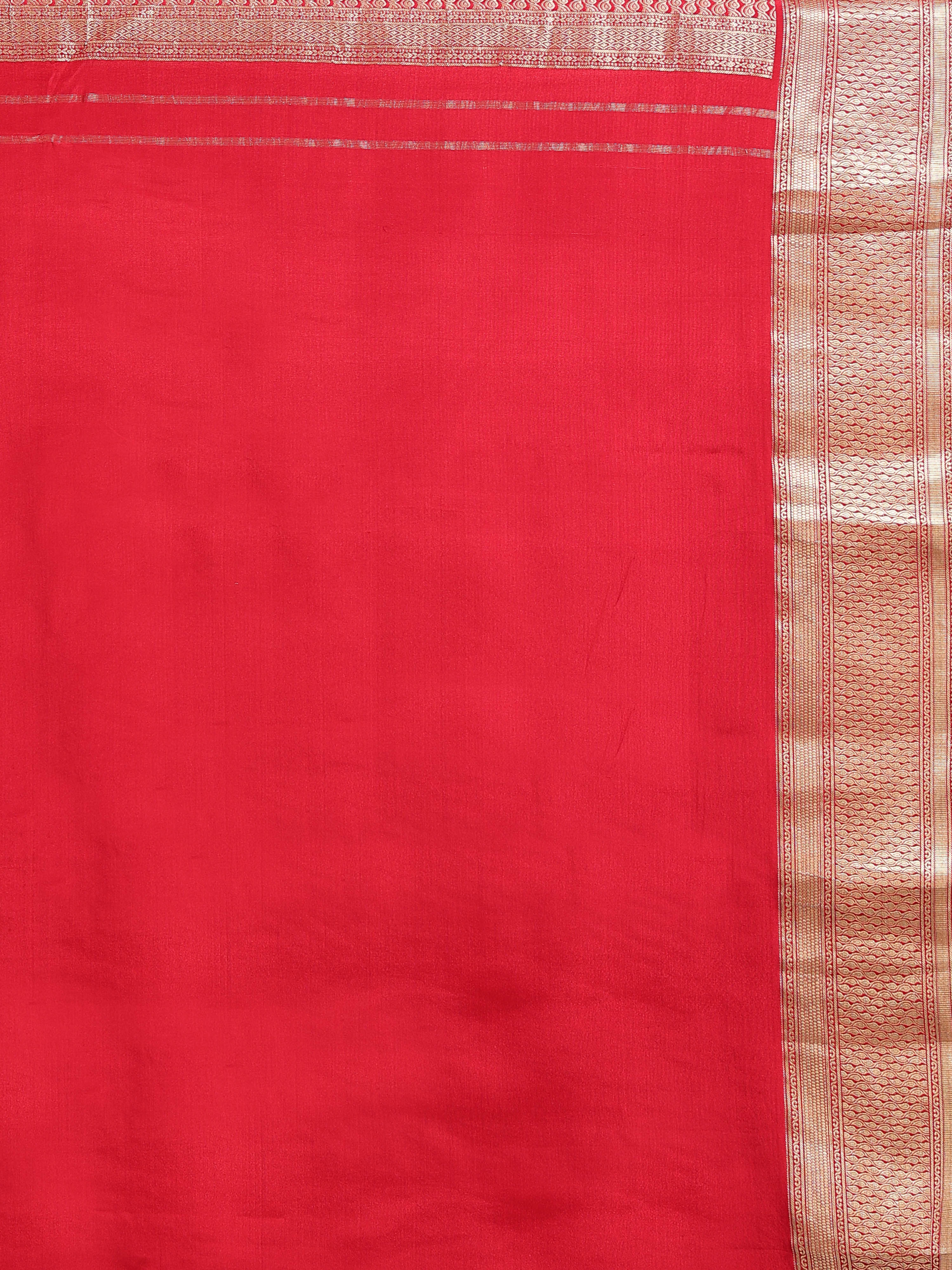 Close up of coral red silk body with fine gold zari vertical stripes and narrow multi-band antique gold zari geometric border