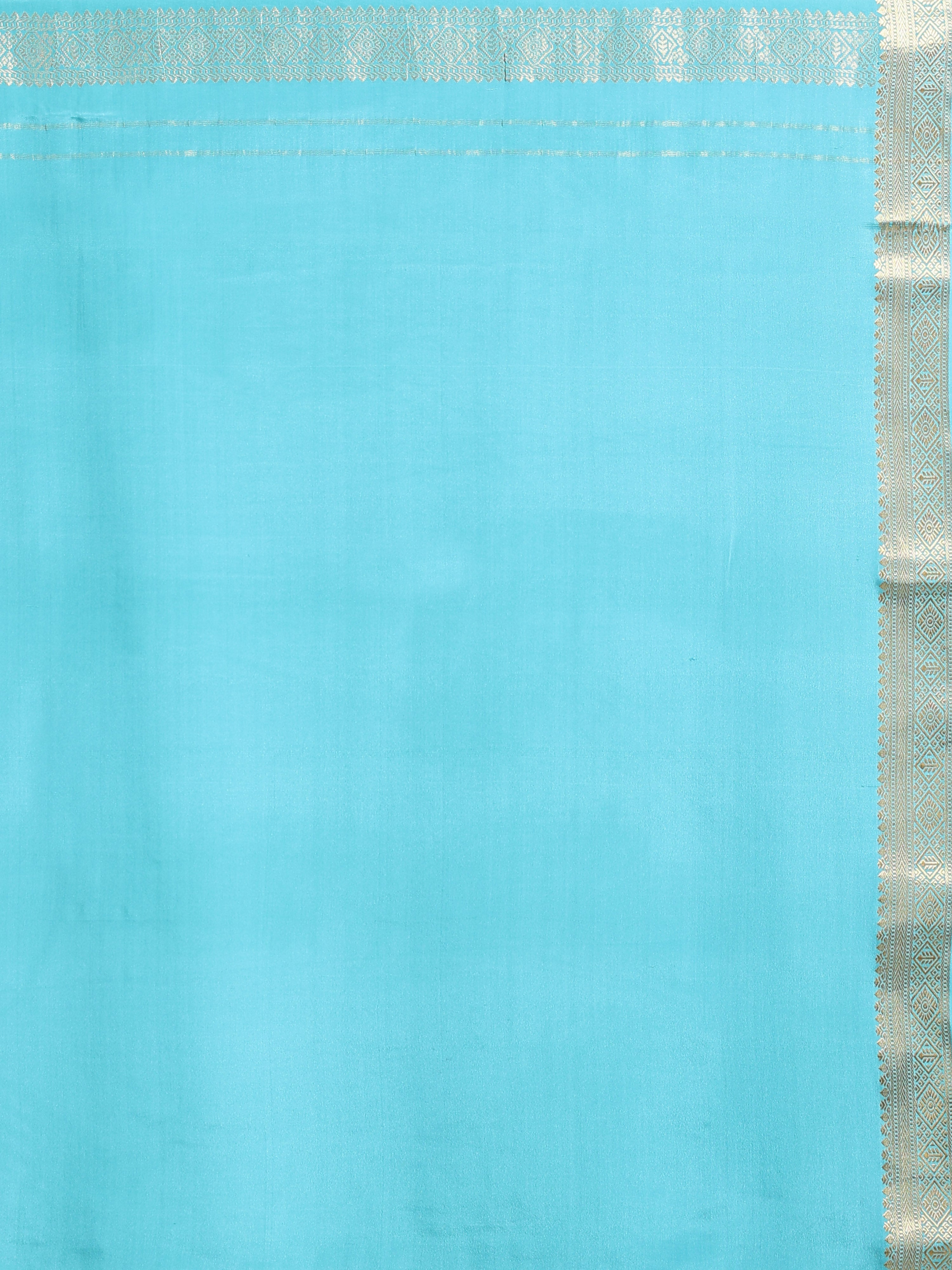Close up of plain turquoise silk body with narrow silver gold zari diamond motif border