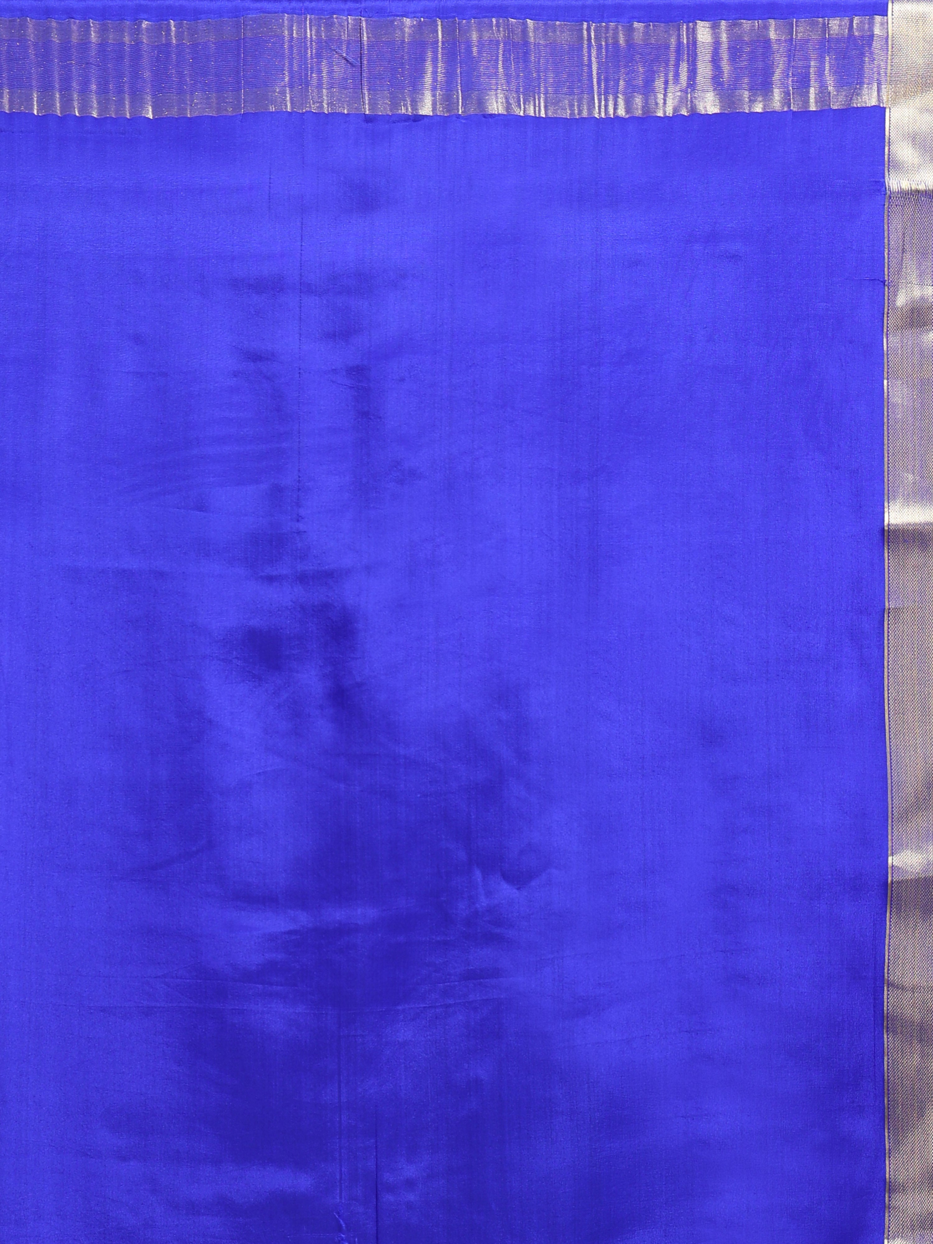 Close up of plain royal blue silk body with natural lustre and narrow silver gold zari geometric border