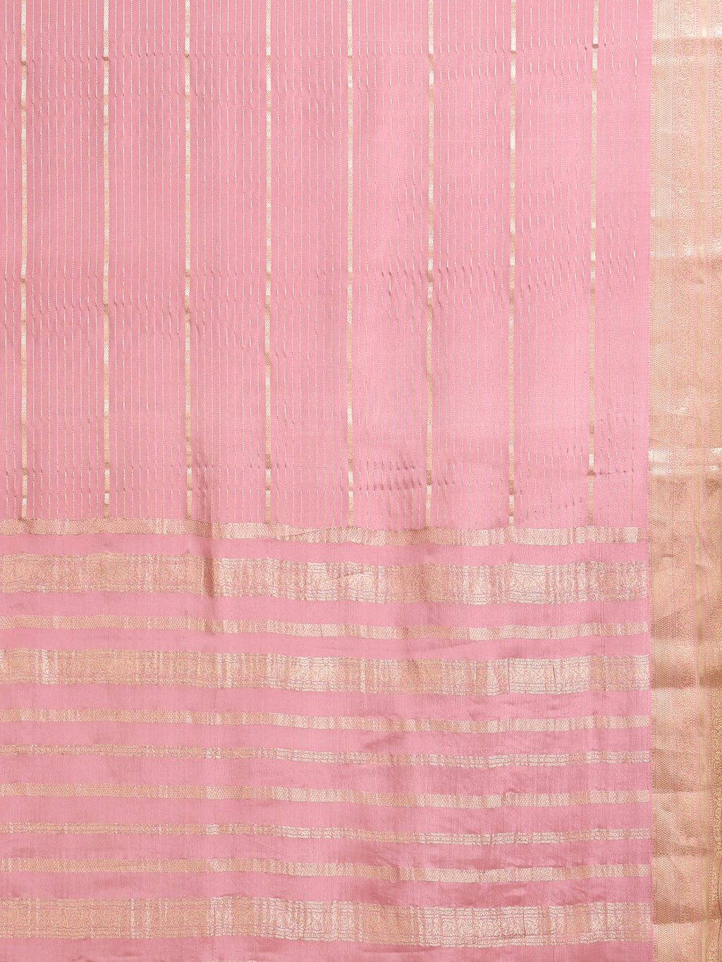 Close up of soft baby pink body with scattered gold zari buttas and large gold zari check pallu with dense vertical stripe upper pallu