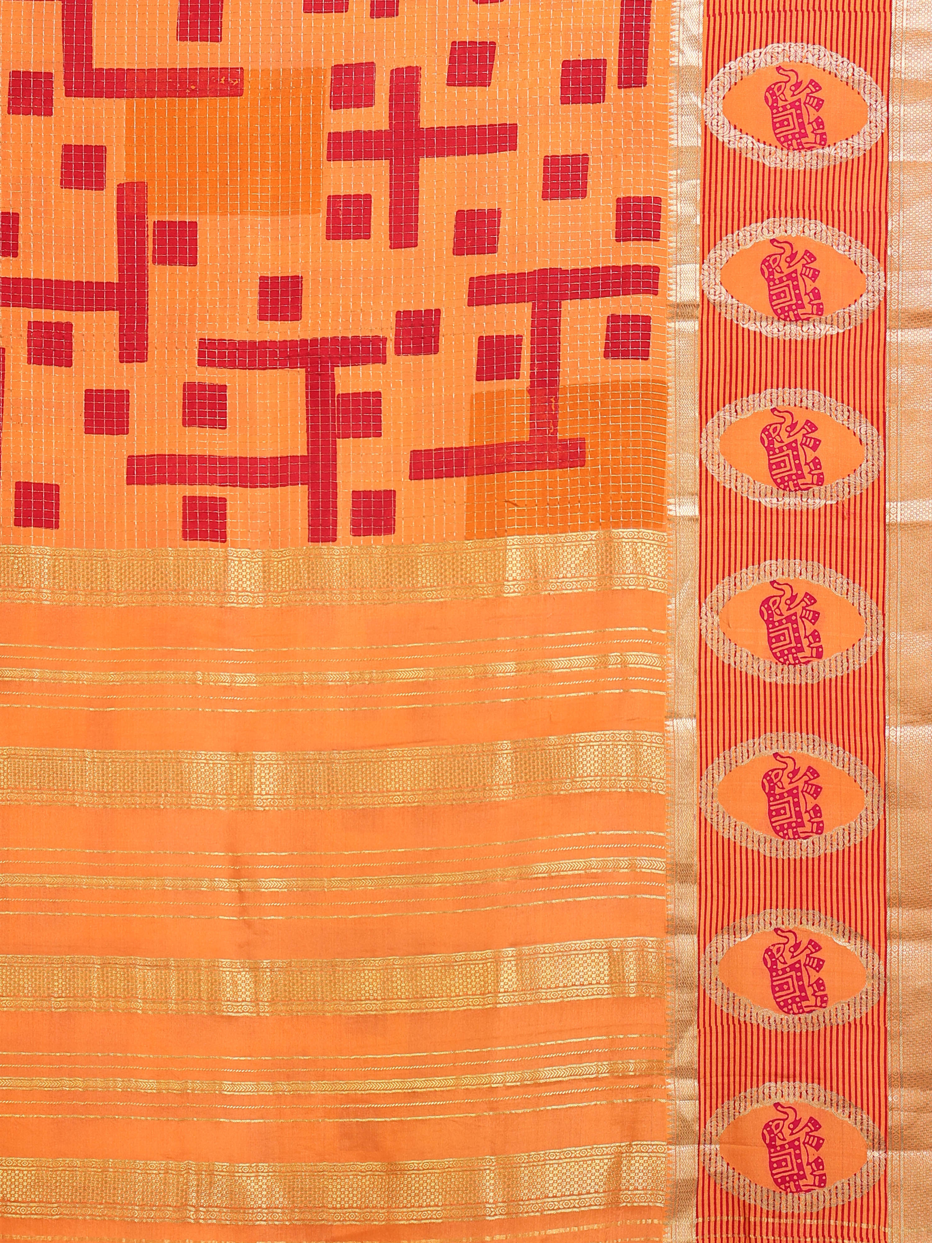 Close up of mango orange body with bold red geometric maze block motifs and gold zari check base; oval elephant medallion border