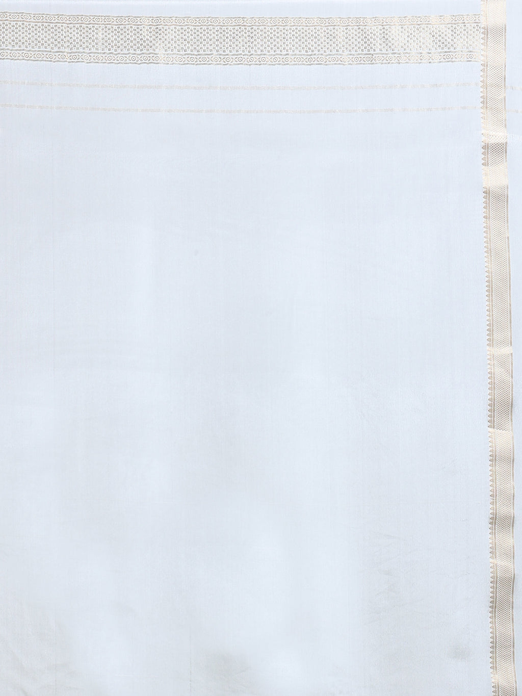 Close up of plain soft white silk blouse piece with narrow antique gold zari geometric floral border