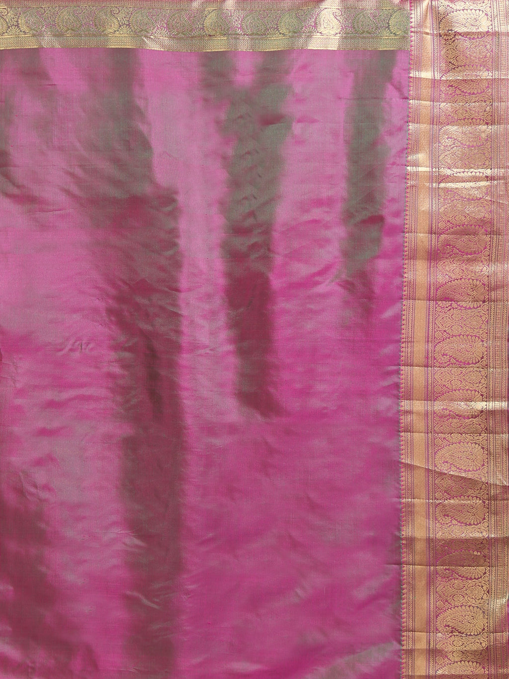Close up of hot pink teal iridescent shot silk blouse piece showing colour shift with narrow antique gold zari floral scrollwork border