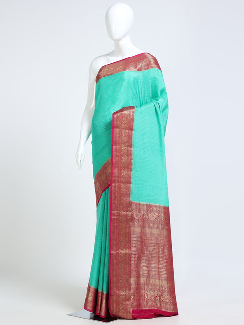 Aqua Green Mysore Crepe Pure Silk Saree with contrast magenta heavily worked zari pallu - mannequin side view