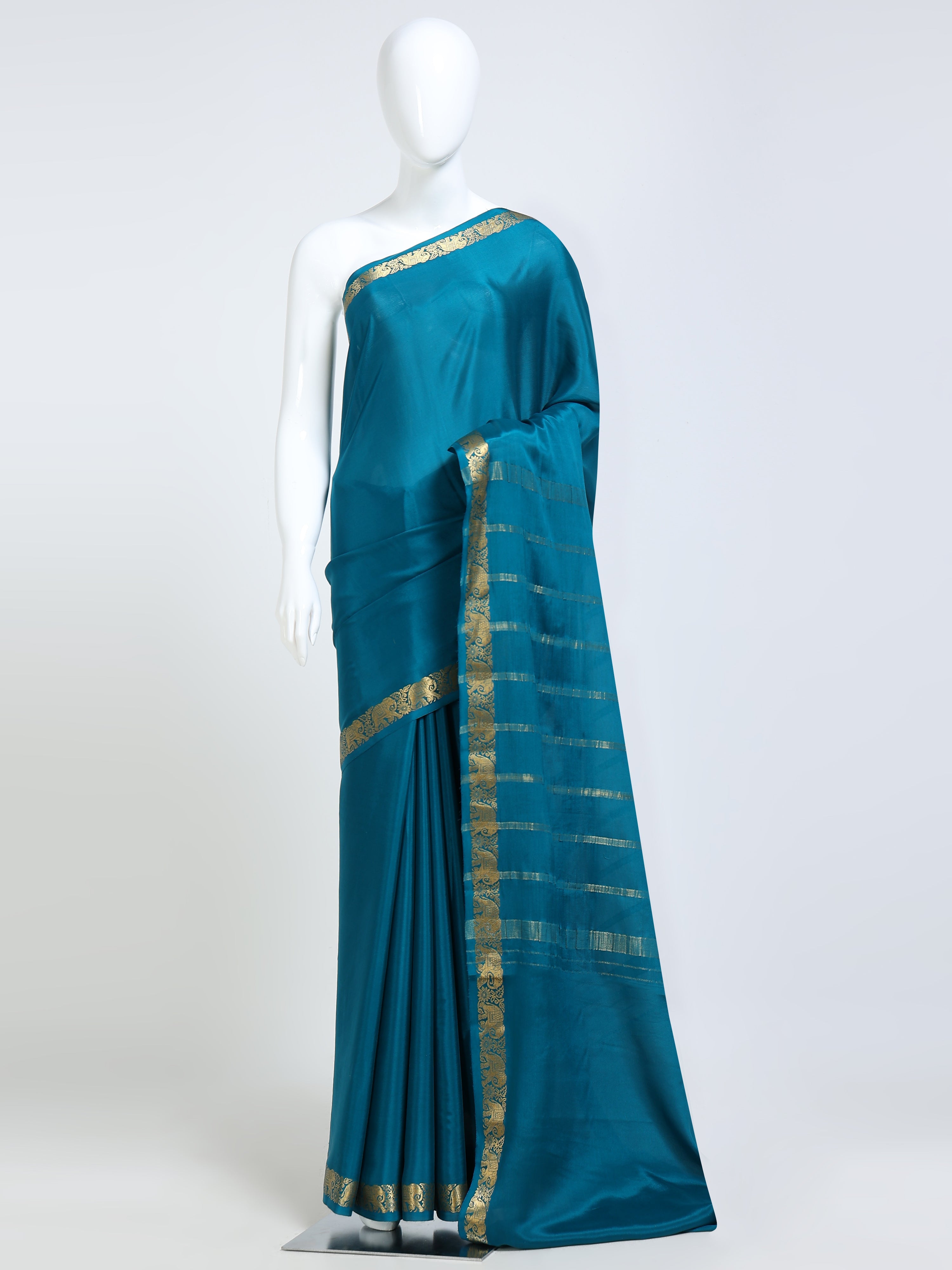 Teal Peacock Blue Mysore Crepe Pure Silk Saree with gold zari stripe pallu and elephant motif border - mannequin front view