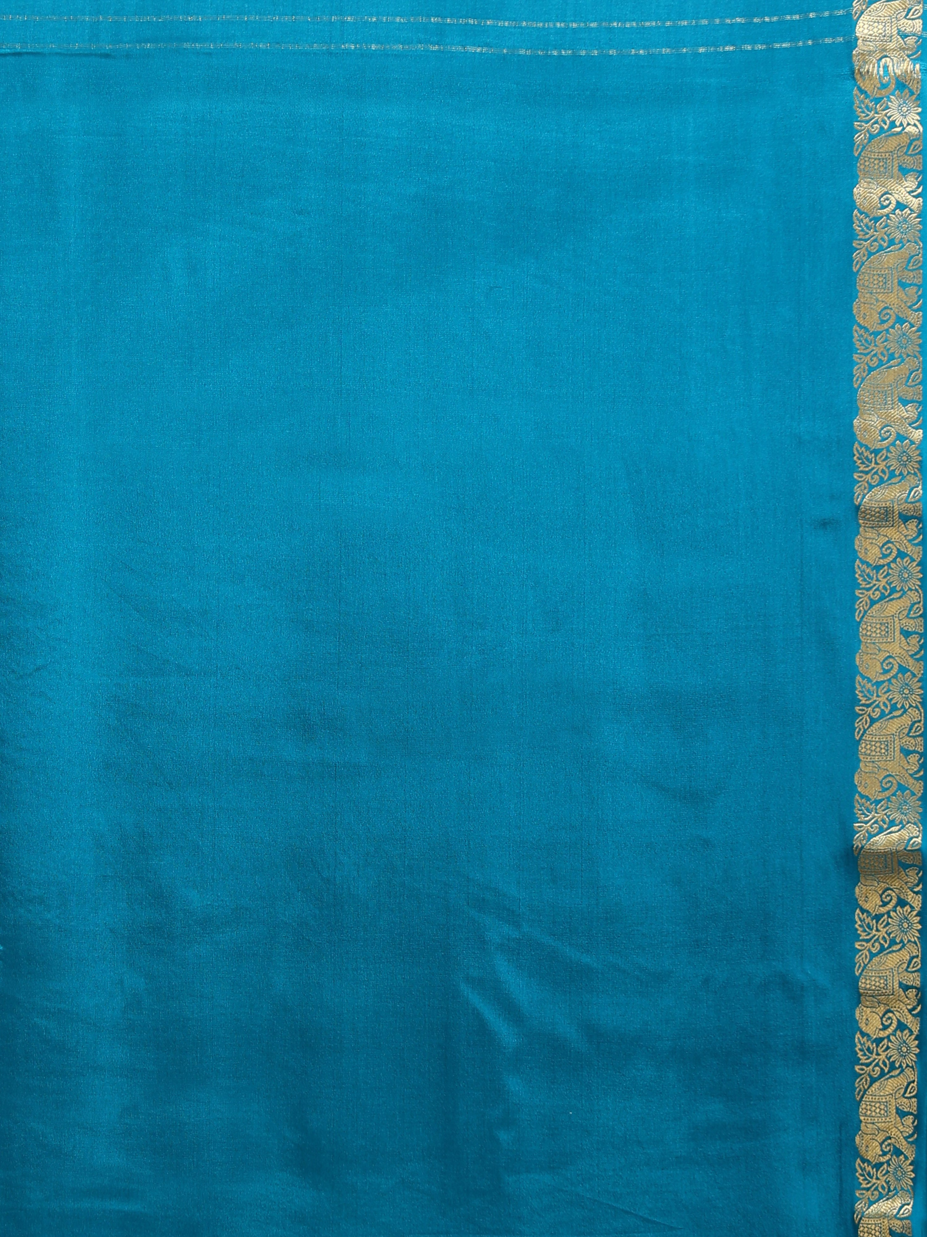 Close up of plain teal silk blouse piece with narrow antique gold bronze zari floral scrollwork and elephant animal motif border