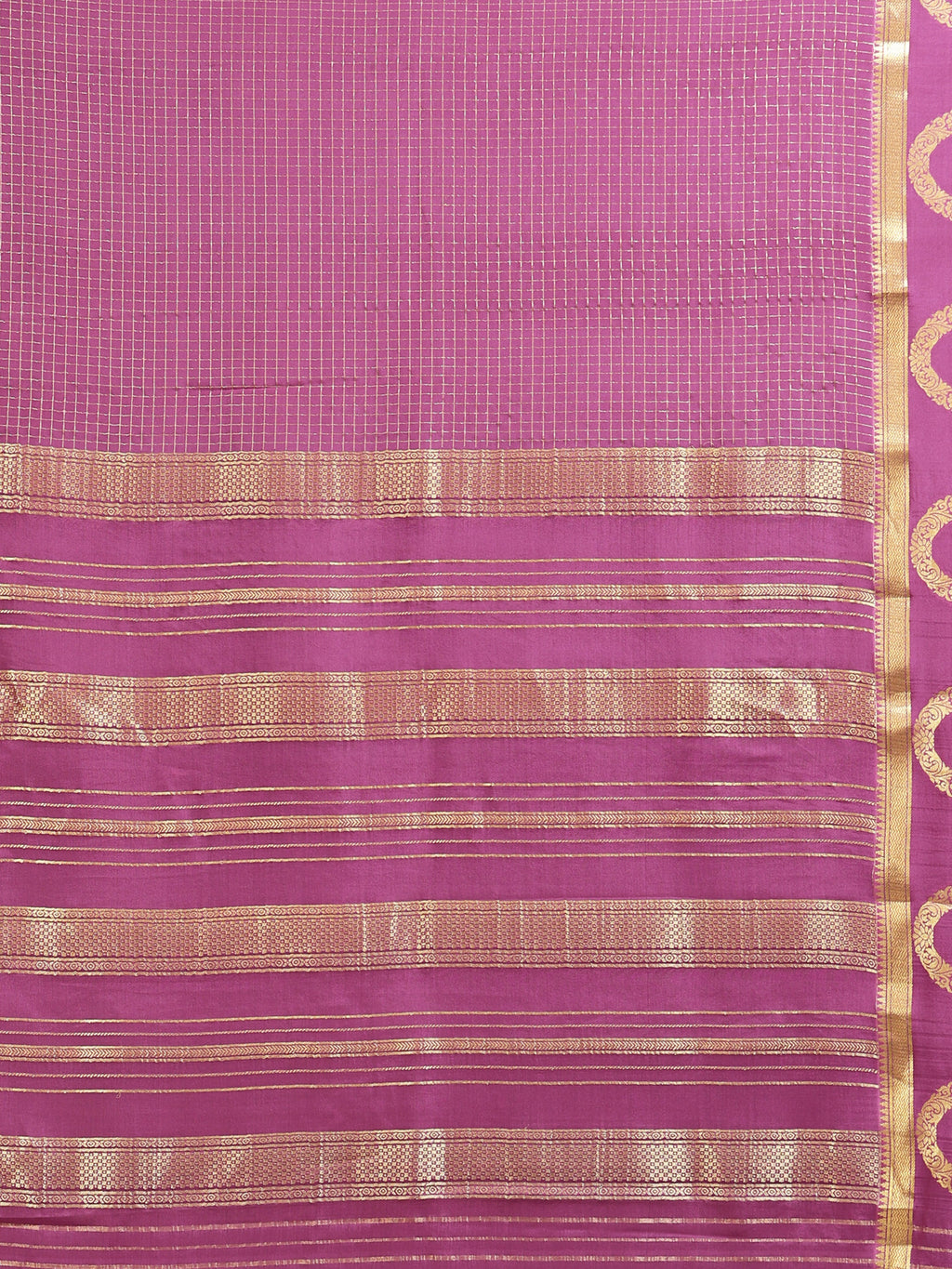 Close up of mauve body with fine gold zari check grid and horizontal stripe pallu bands