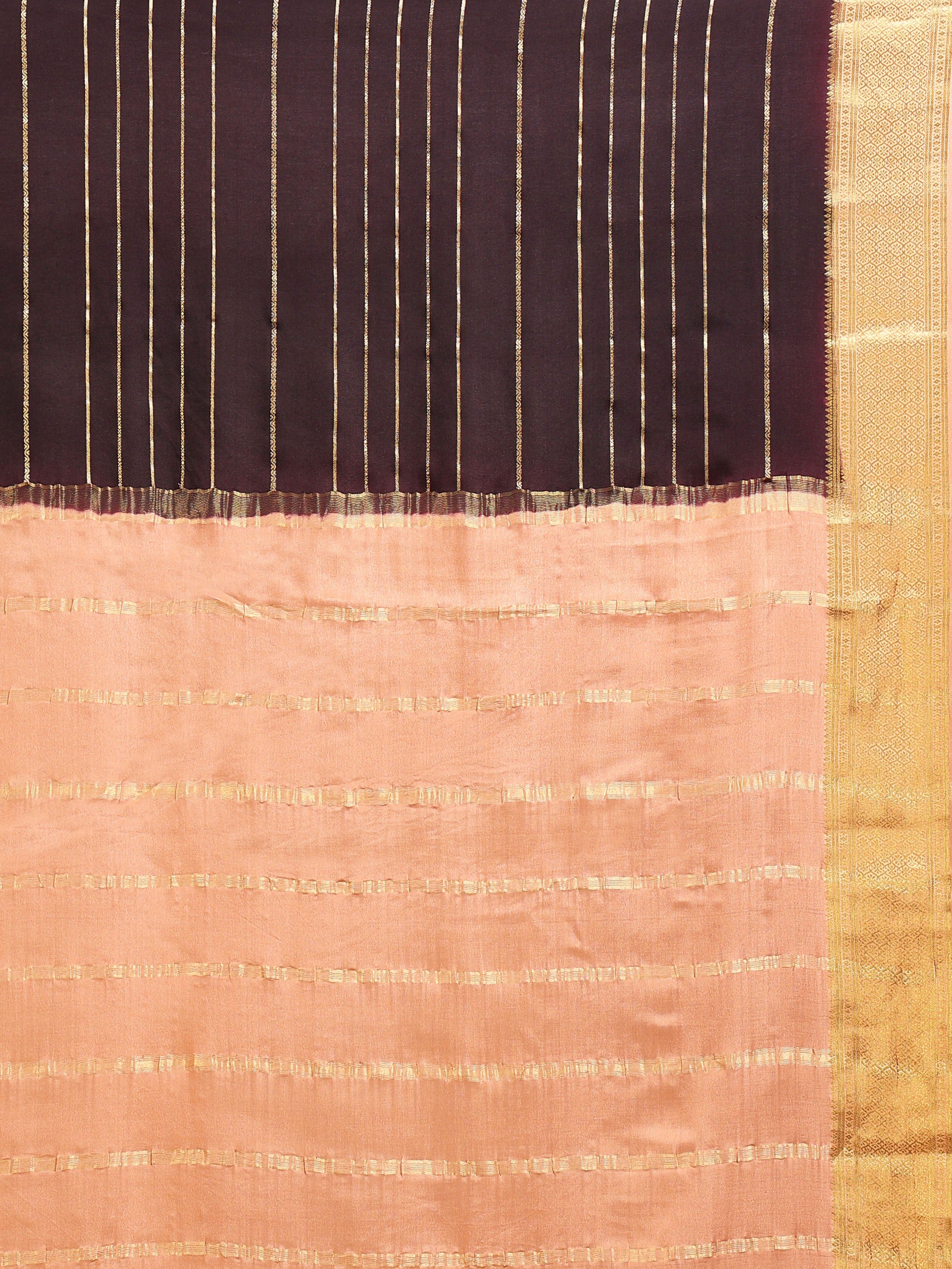 Close up of dark brown body with gold zari vertical stripes and peach pallu with tonal dash motifs