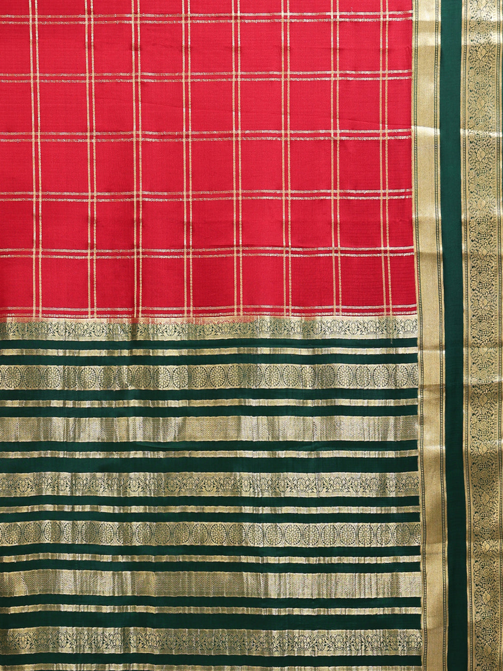 Close up of crimson red body with large gold zari check grid and deep green pallu with gold zari stripe bands