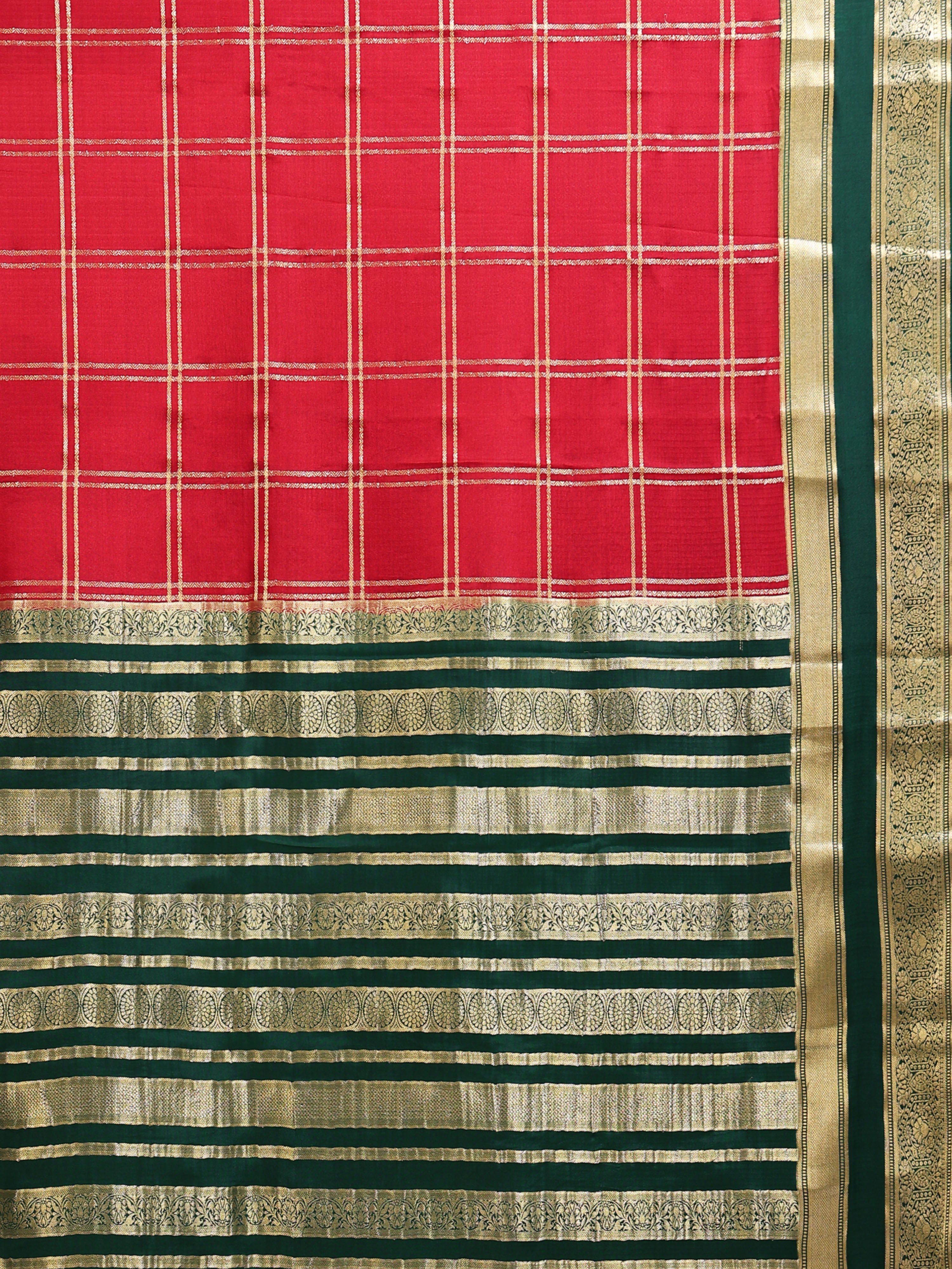 Close up of crimson red body with large gold zari check grid and deep green pallu with gold zari stripe bands